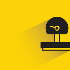 weight scale with shadow on yellow background