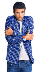 Fototapeta premium Young african amercian man wearing casual clothes shaking and freezing for winter cold with sad and shock expression on face