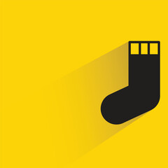 sock with shadow on yellow background
