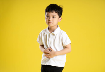 image of asian boy posing on a yellow background.