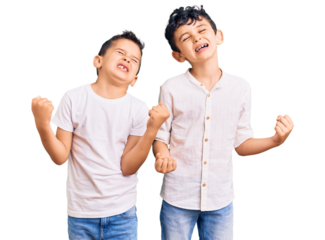 Couple of little brothers together wearing casual clothes very happy and excited doing winner gesture with arms raised, smiling and screaming for success. celebration concept.
