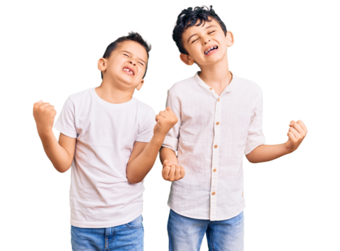 Couple of little brothers together wearing casual clothes very happy and excited doing winner gesture with arms raised, smiling and screaming for success. celebration concept.
