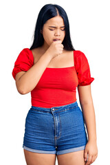 Fototapeta premium Young beautiful asian girl wearing casual clothes feeling unwell and coughing as symptom for cold or bronchitis. health care concept.