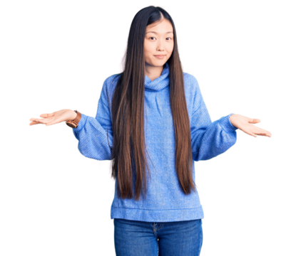 Young beautiful chinese woman wearing casual turtleneck sweater clueless and confused expression with arms and hands raised. doubt concept.