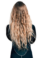 Naklejka premium Young blonde woman wearing diver neoprene uniform standing backwards looking away with crossed arms