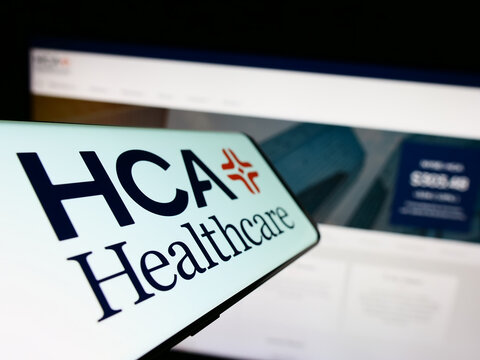 Stuttgart, Germany - 07-02-2023: Smartphone with logo of American company HCA Healthcare Inc. on screen in front of business website. Focus on center-left of phone display.