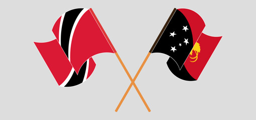 Crossed and waving flags of Trinidad and Tobago and Papua New Guinea