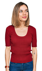 Obraz premium Young blonde girl wearing casual clothes smiling looking to the side and staring away thinking.