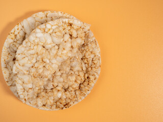 Rice waffles on a beige background with copy space. Rice wafers close-up.