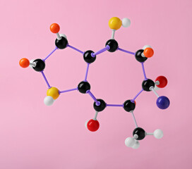 Structure of molecule on pink background. Chemical model