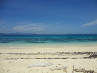 Beautiful White Sand Beach Located in North Maluku, Indonesia. Beautiful Scenery of Blue Sky, Ocean and White Sand Beach.