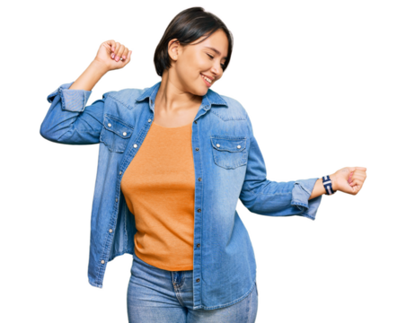 Young beautiful hispanic woman with short hair wearing casual denim jacket dancing happy and cheerful, smiling moving casual and confident listening to music - Powered by Adobe