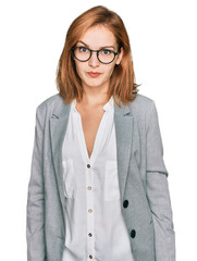 Young caucasian woman wearing business style and glasses skeptic and nervous, frowning upset because of problem. negative person.