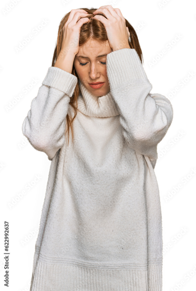 Wall mural Young irish woman wearing casual winter sweater suffering from headache desperate and stressed because pain and migraine. hands on head.