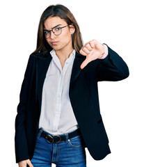 Young caucasian girl wearing business style and glasses looking unhappy and angry showing rejection and negative with thumbs down gesture. bad expression.