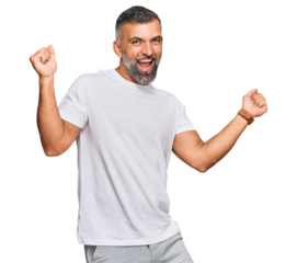 Middle age handsome man wearing casual white tshirt dancing happy and cheerful, smiling moving casual and confident listening to music