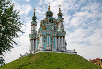 Fototapeta na wymiar Andreevsky Church - Orthodox Church with onion domes, located in the city of Kyiv on Andreevsky descent