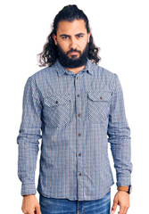 Young arab man wearing casual clothes skeptic and nervous, frowning upset because of problem. negative person.