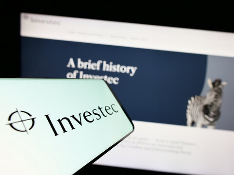 Stuttgart, Germany - 07-04-2023: Smartphone with logo of financial services company Investec Group on screen in front of business website. Focus on center of phone display.