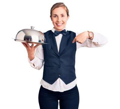 Young beautiful blonde woman wearing waitress uniform holding tray pointing finger to one self smiling happy and proud