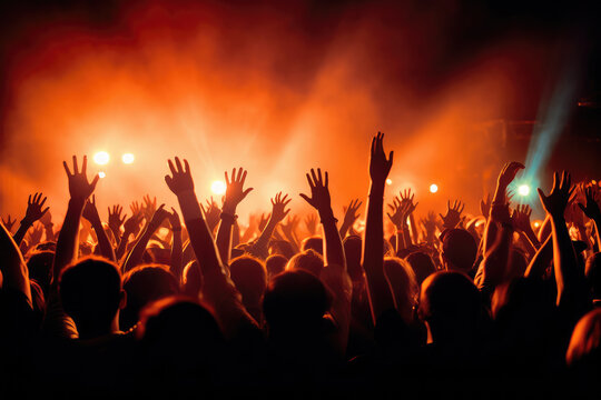 Many people happily raised their hands in the concert hall