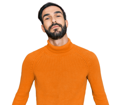 Young hispanic man wearing casual clothes relaxed with serious expression on face. simple and natural looking at the camera.