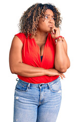 Young african american plus size woman wearing casual style with sleeveless shirt thinking worried about a question, concerned and nervous with hand on chin