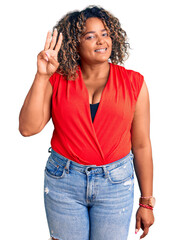 Young african american plus size woman wearing casual style with sleeveless shirt showing and pointing up with fingers number three while smiling confident and happy.