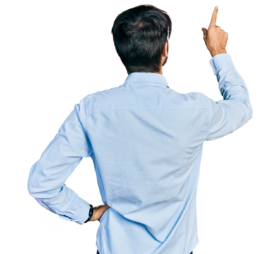Hispanic man with blue eyes wearing business shirt posing backwards pointing ahead with finger hand