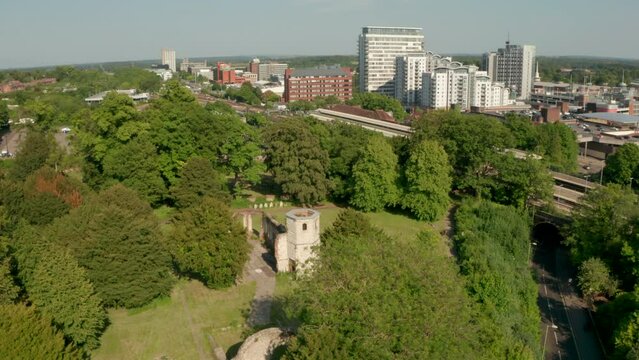 Circling aerial shot of the Holy Ghost Cemetery with Basingstoke in the background