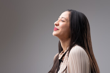 Woman suppresses joy, anticipating bright future
