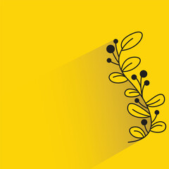 leaves and branches with shadow on yellow background