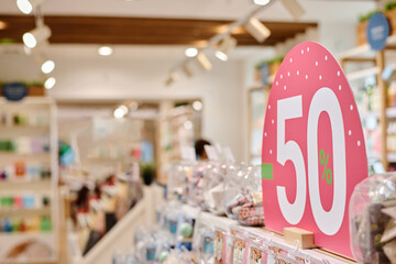 Close-up of sign with big sale in shopping mall