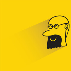 male face with shadow on yellow background