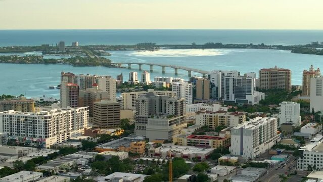 Above view of Sarasota city, Florida with waterfront office highrise buildings and John Ringling Causeway leading from downtown to St. Armands Key. Development of housing and transportation in the US