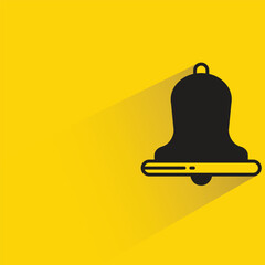 bell with shadow on yellow background