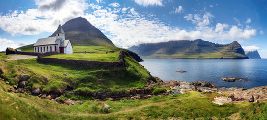Church by the sea with ocean and mountain panorama, Vidareidi, Viðareiði, Faroe Islands, Denmark, Northern Europe