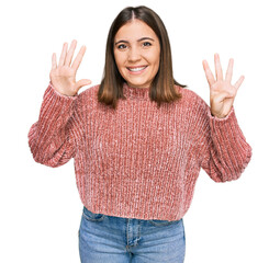 Young beautiful woman wearing casual clothes showing and pointing up with fingers number nine while...