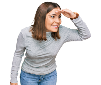 Young beautiful woman wearing casual turtleneck sweater very happy and smiling looking far away with hand over head. searching concept.