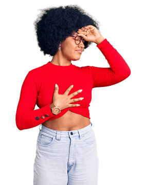 Young african american girl wearing casual clothes and glasses touching forehead for illness and fever, flu and cold, virus sick