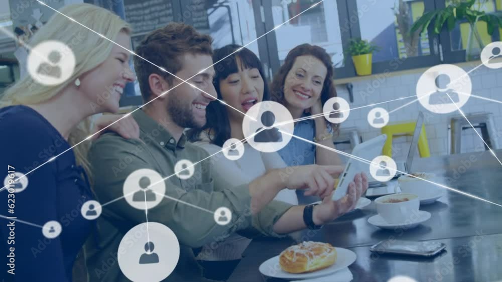 Poster animation of network of profile icons over happy diverse colleagues using tablet in a cafe at office