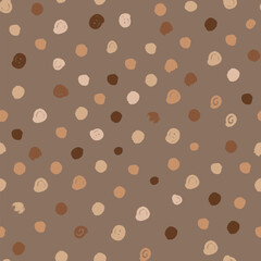 Polka dot seamless pattern with irregular circles in beige and brown shades. Naive drawing