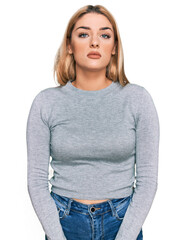 Obraz premium Young caucasian woman wearing casual clothes with serious expression on face. simple and natural looking at the camera.