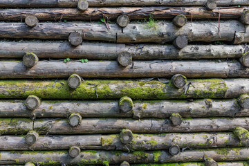 Protect retaining structure in form of wooden logs crib wall