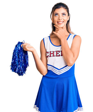 Young beautiful woman wearing cheerleader uniform with hand on chin thinking about question, pensive expression. smiling and thoughtful face. doubt concept.
