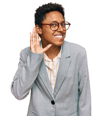 Young african american woman wearing business clothes smiling with hand over ear listening an...