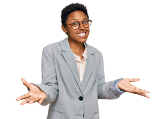 Young african american woman wearing business clothes smiling cheerful with open arms as friendly welcome, positive and confident greetings