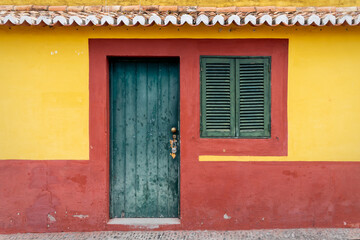 Fototapeta na wymiar Old colorful house in a street of the old town of Funchal, Madeira island, Portugal