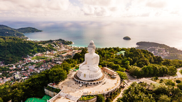 Phuket Big Buddha statue. afternoon light sky and blue ocean are on the back of white Phuket big Buddha is the one of landmarks on Phuket island Thailand.