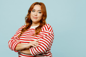 Side view happy young chubby overweight woman she wearing striped red shirt casual clothes hold...